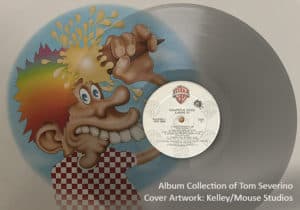 Vinyl record with colorful cartoon face splash