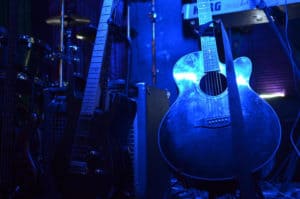 guitar in blue stage light
